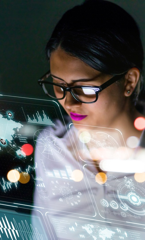 Woman engineer looking at various information in for cyber-physical systems