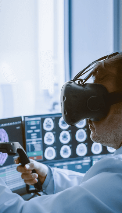 Surgeon wearing virtual reality headset to operate with medical robot